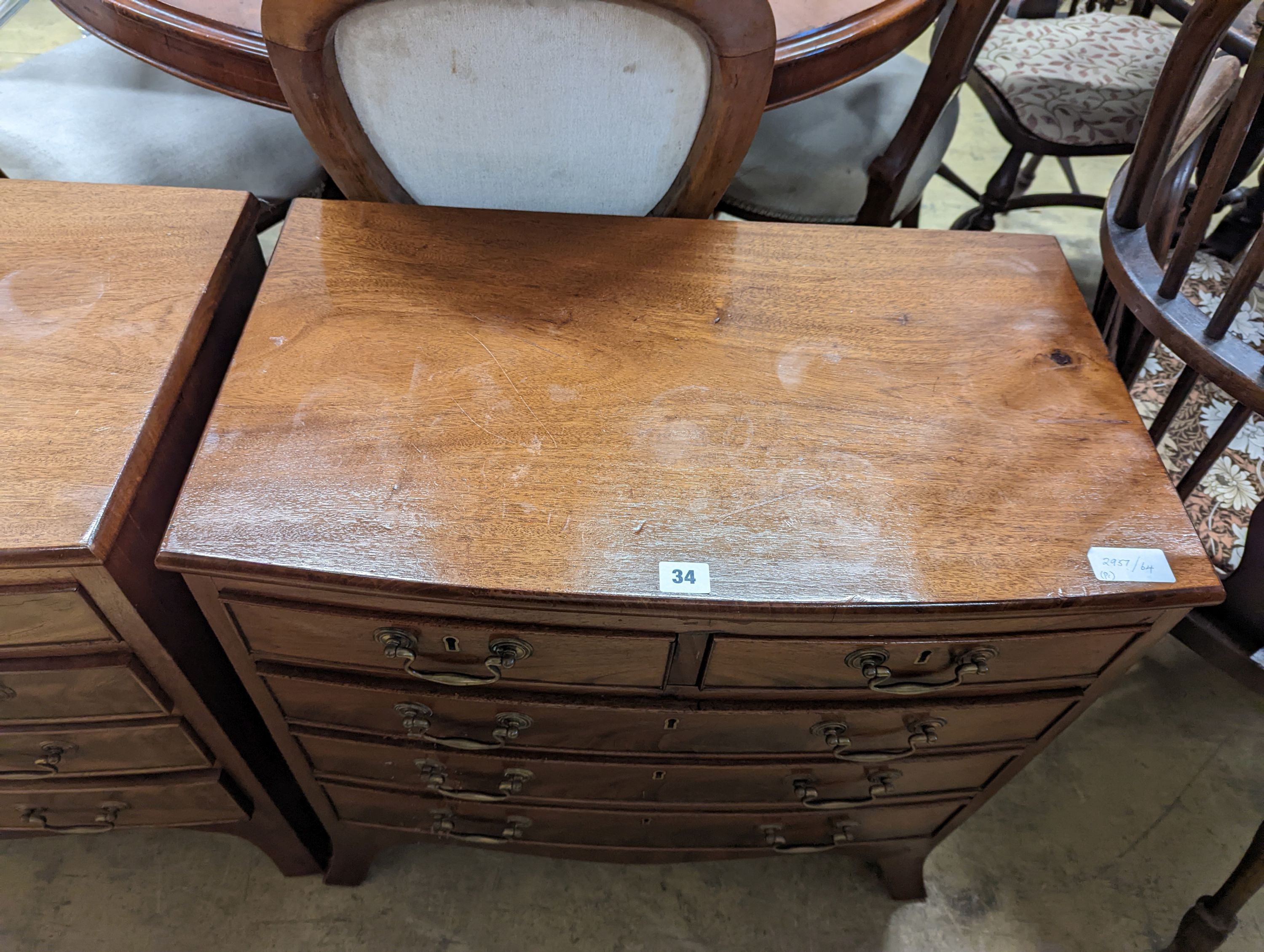 A pair of reproduction George III style bow fronted mahogany bedside chests, width 66cm, depth 39cm, height 64cm